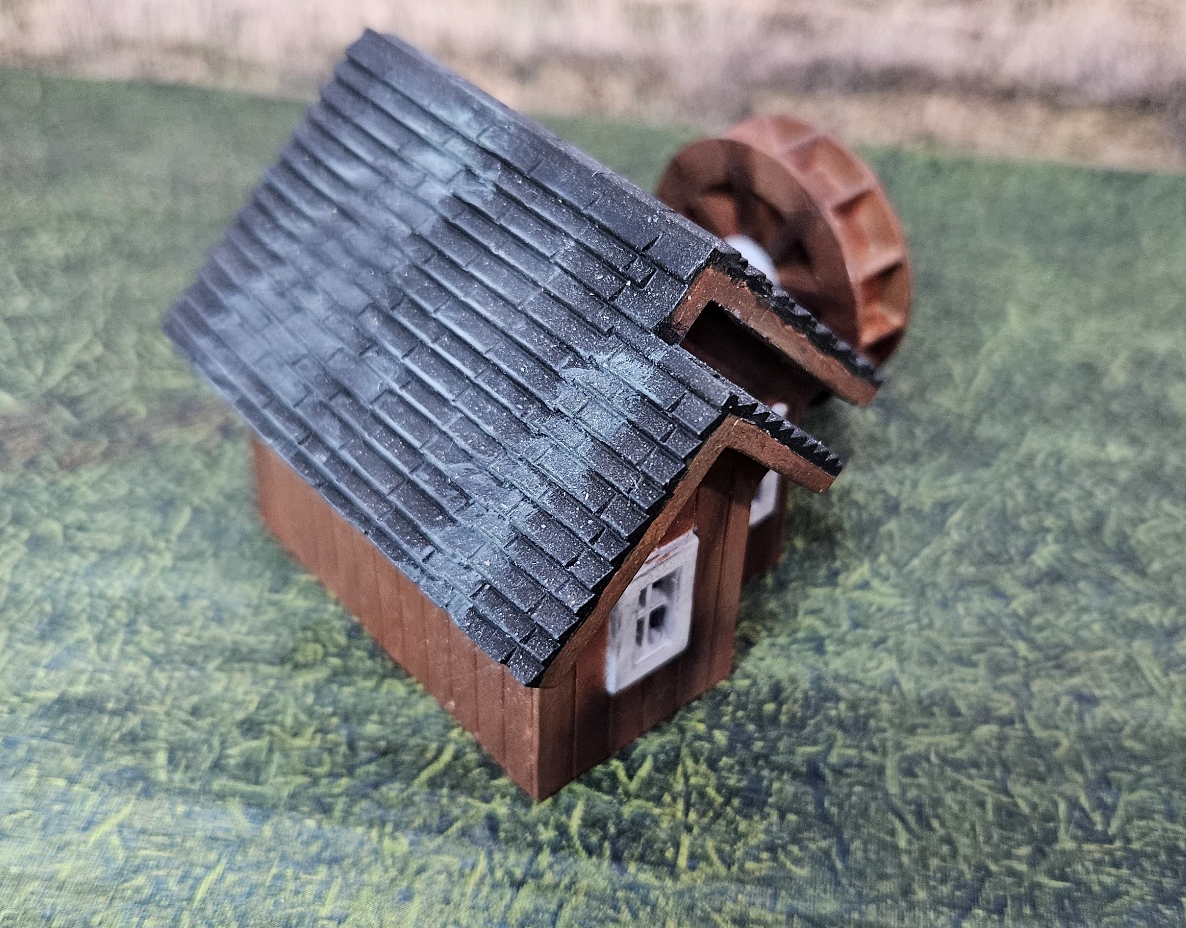 Close-up of rotating waterwheel on HO scale small building kit